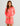 Woman modeling a bright pink long-sleeve women's beach cover-up with side ties against a light background.