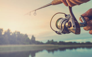 fishing on lake at sunset