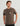 Man wearing HUK KC One Hit Short Sleeve Pocket Tee in Mud