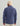 Man wearing navy blue fleece shacket with collar, shown from back view, paired with cream beanie and tan pants.