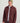 Maroon fleece shacket with button front, chest pockets, and collar worn over gray t-shirt and dark pants.