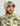 Cream and green camouflage fleece hoodie with attached hood and navy visor on wearer.