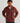 Man wearing HUK Men's Helm 1/2 Zip Fleece Pullover in Port