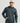 Man wearing HUK Men's Coldfront+ Fleece Hoodie in Sea Storm