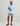 Light blue button-up hoodie shirt with chest pocket, worn with gray shorts and tan sandals.