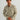Man wearing HUK Men's Hanahan Long Sleeve Flannel Shirt in Moss