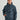 Man wearing HUK Men's Storm Printed 3-Layer Jacket in Sea Storm