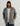Man wearing HUK Men's Easton Hooded Jacket in Sharkskin Heather