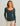 Woman wearing HUK Bayside Longsleeve Scoop Neck in Vntg Indgo Heather