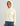 Woman wearing HUK Women's Leeward Boxy Fleece Hoodie in Egret