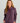 Woman wearing HUK Women's Camden Snap Fleece Pullover in Coastl Dsk Heather