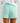 Huk women's Isla Short in Caicos, moisture-wicking fishing shorts, side view