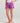 Purple swim shorts with white drawstring waistband and small logo on leg.