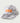 Gray and white tie-dye trucker hat with orange Huk logo patch and mesh back panels.
